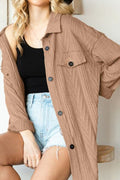 Camel colored jacket with drop shoulders and button-up front worn by a model.