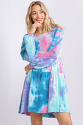 A beautiful long sleeve boho dress featuring a vibrant print in blue, pink, and purple