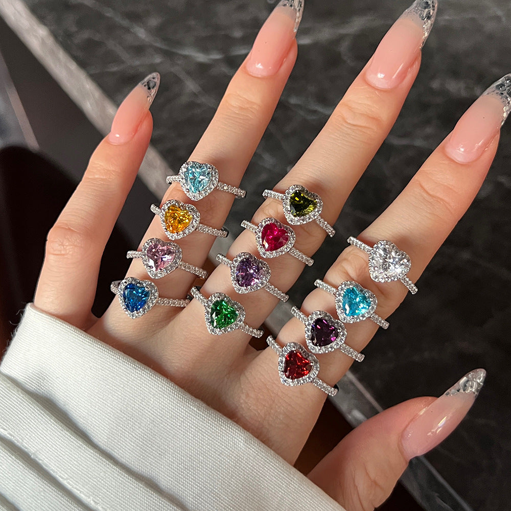 Close-up of a silver zodiac ring featuring colorful zircon stones