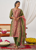 Close up of peach organza suit with intricate embroidery and shimmering gota patti work
