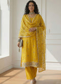 Yellow shimmer organza suit featuring detailed Gota Patti and intricate embroidery