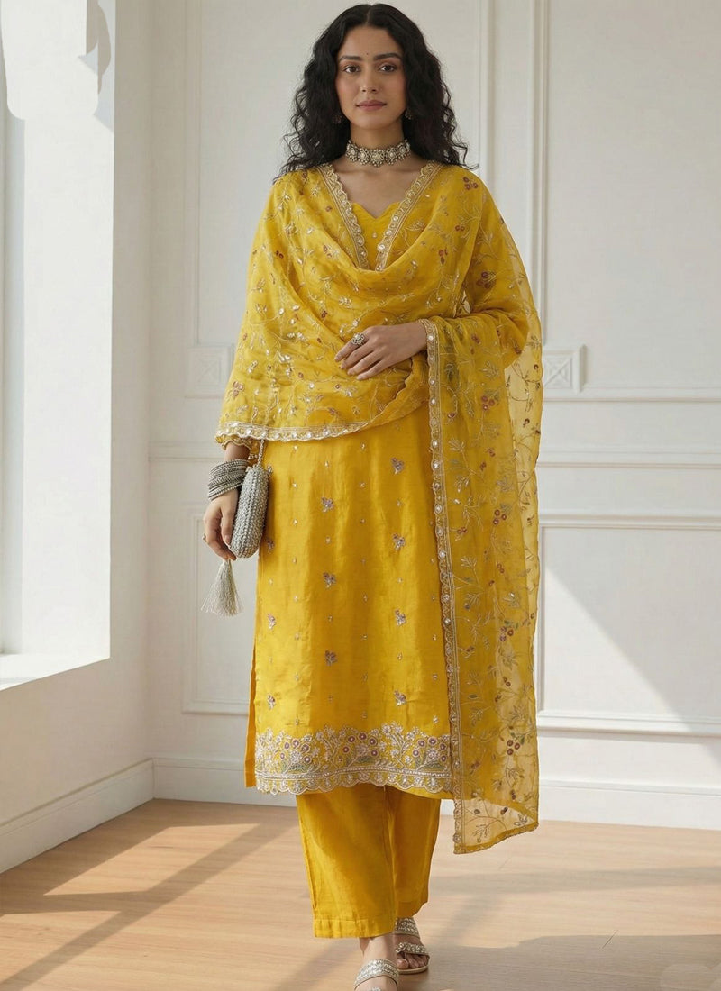 Yellow shimmer organza suit featuring detailed Gota Patti and intricate embroidery