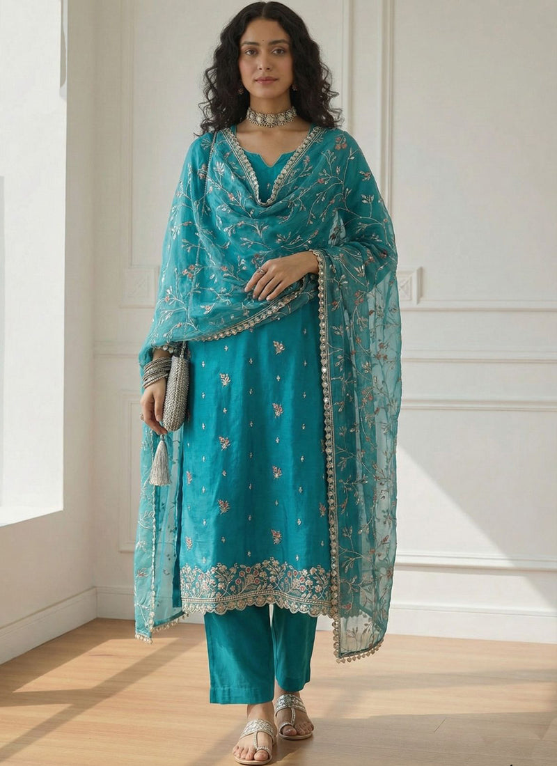 Sky blue shimmer organza suit with intricate Gota Patti embroidery and festive party wear detailing.