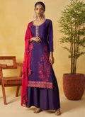 Woman wearing a violet organza palazzo suit with intricate gota patti and embroidery details