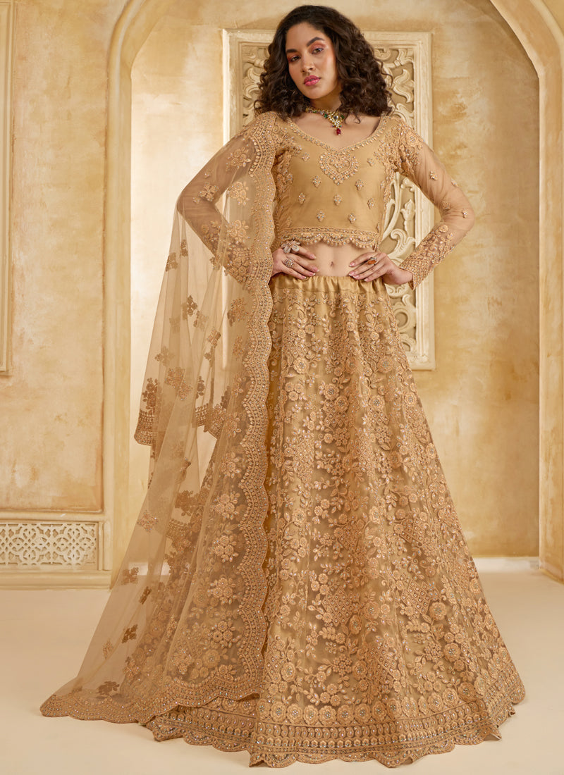 Beige net wedding lehenga featuring detailed thread work embroidery
