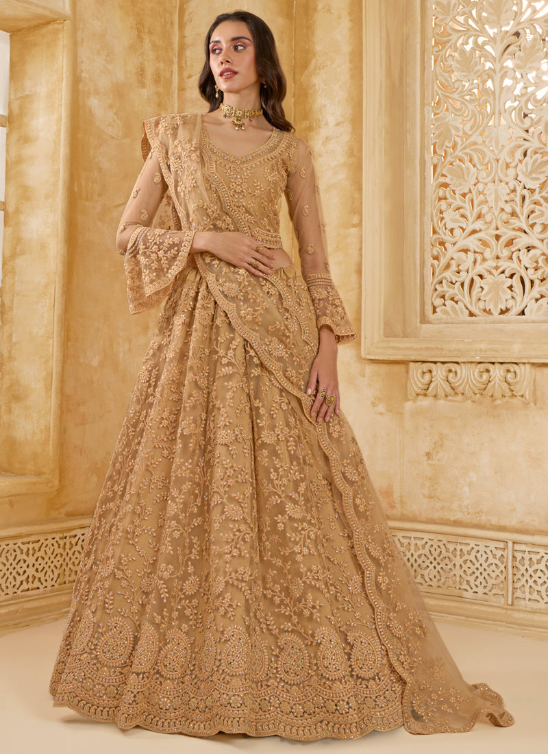 Elegant beige net wedding lehenga with intricate thread work embroidery and matching blouse.