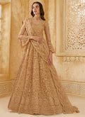 Elegant beige net wedding lehenga with intricate thread work embroidery and matching blouse.
