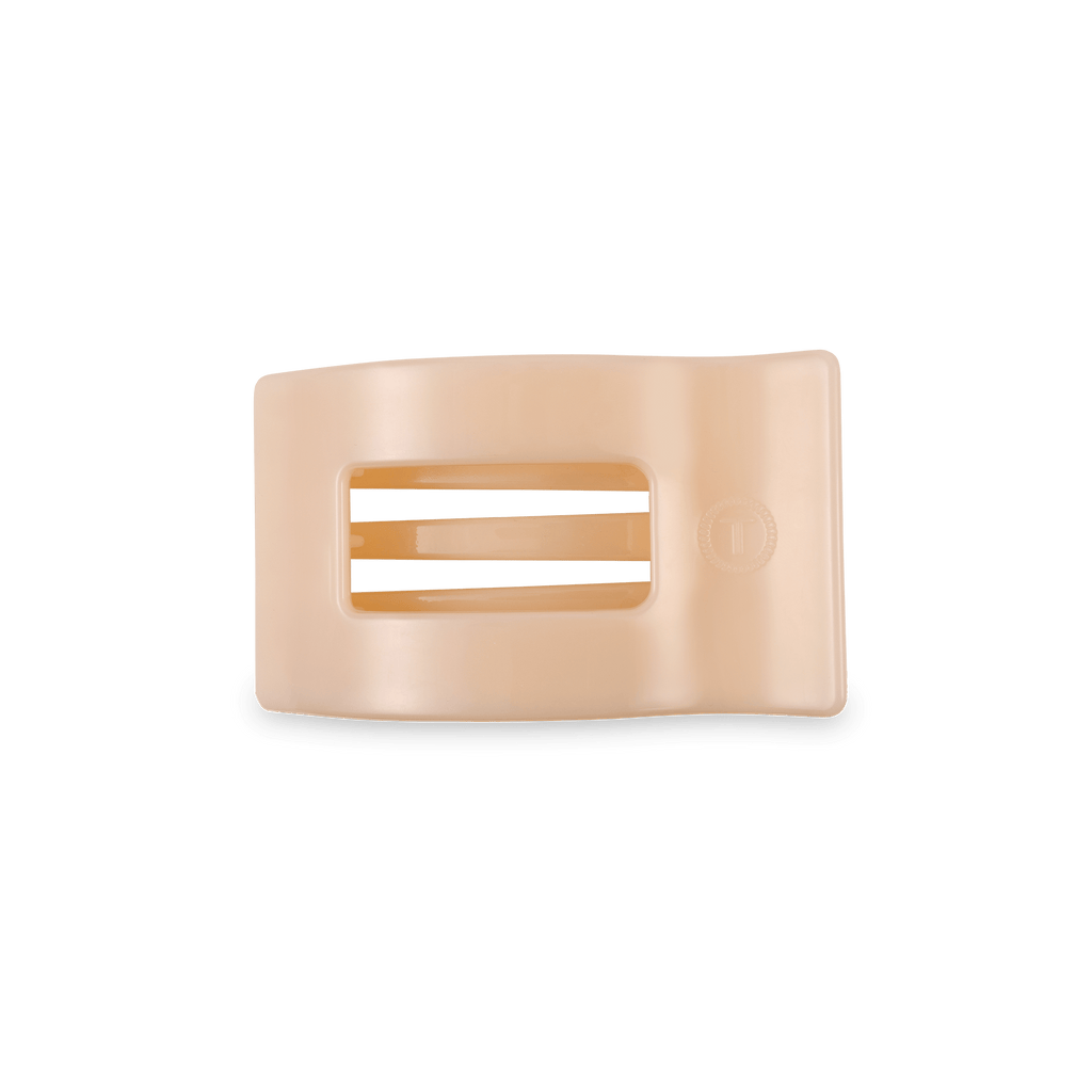 Small flat rectangular hair clip in a neutral Almond Beige color.