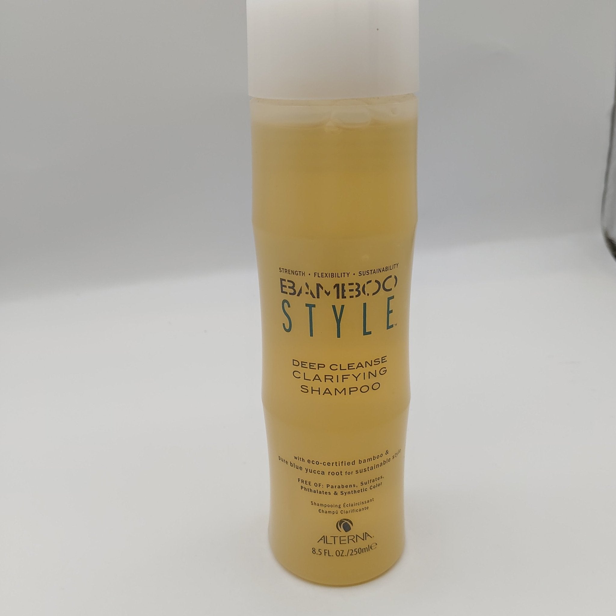 Alterna Bamboo Style Deep Cleanse Clarifying Shampoo in gold and white minimalist packaging.