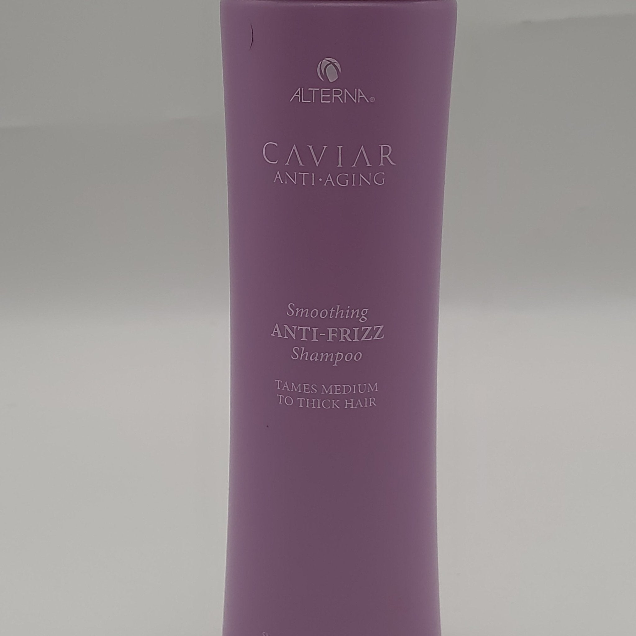 Purple bottle of Alterna Caviar Anti-Aging Smoothing Anti-Frizz Shampoo for medium to thick hair.
