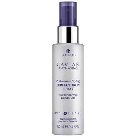 A bottle of Alterna Caviar Professional Styling Perfect Iron Spray 4.2 oz for heat protection.