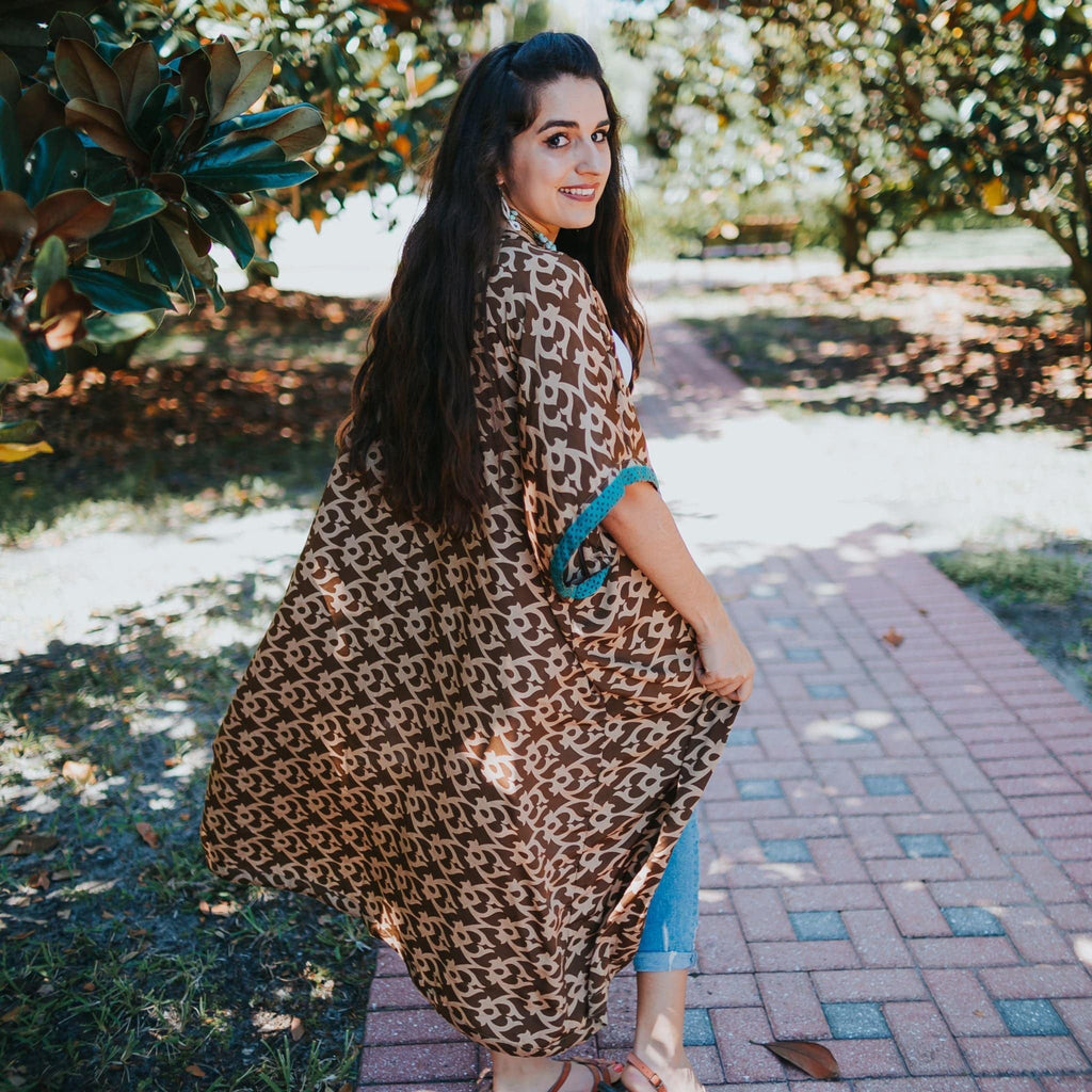 Amara Long Sari Duster in a lightweight, flowing silhouette worn as a stylish layering piece.