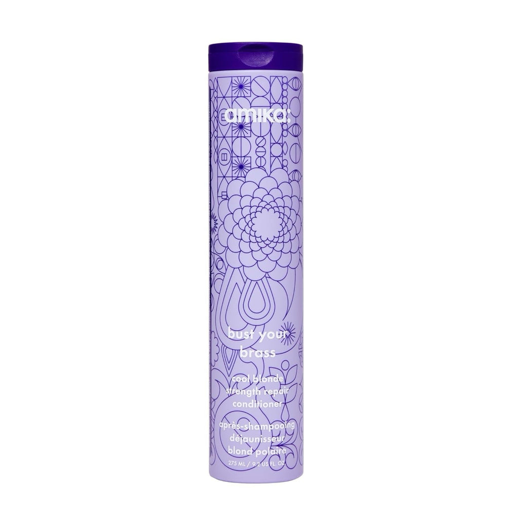 Amika Bust Your Brass Cool Blonde Strength Repair Conditioner bottle in purple and white.