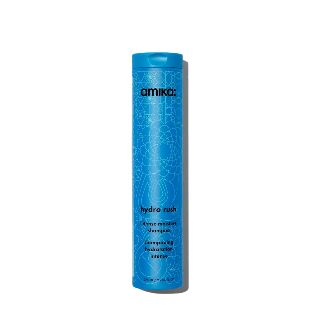 Amika Hydro Rush Intense Moisture Shampoo in blue bottle.