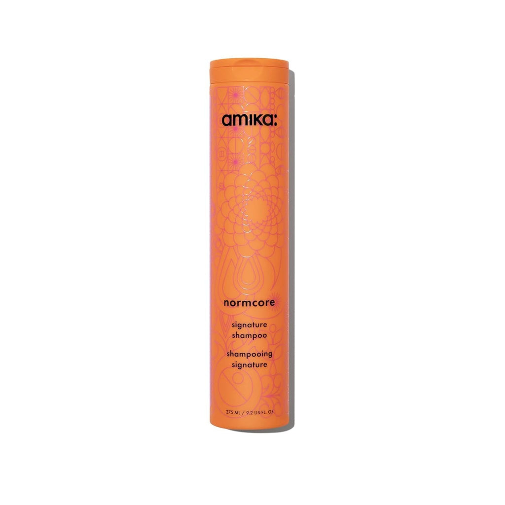 Bottle of Amika Normcore Signature Shampoo for daily hydrating hair care
