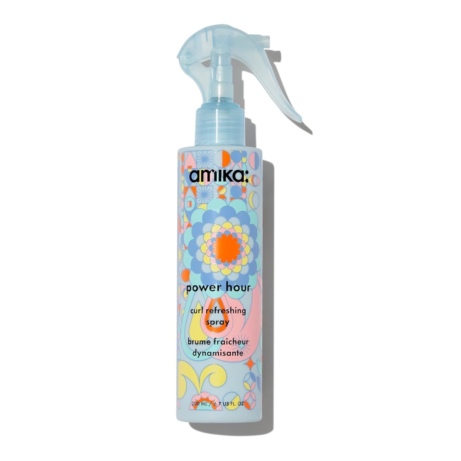 Amika Power Hour Curl Refreshing Spray bottle in light-blue and multicolor packaging.