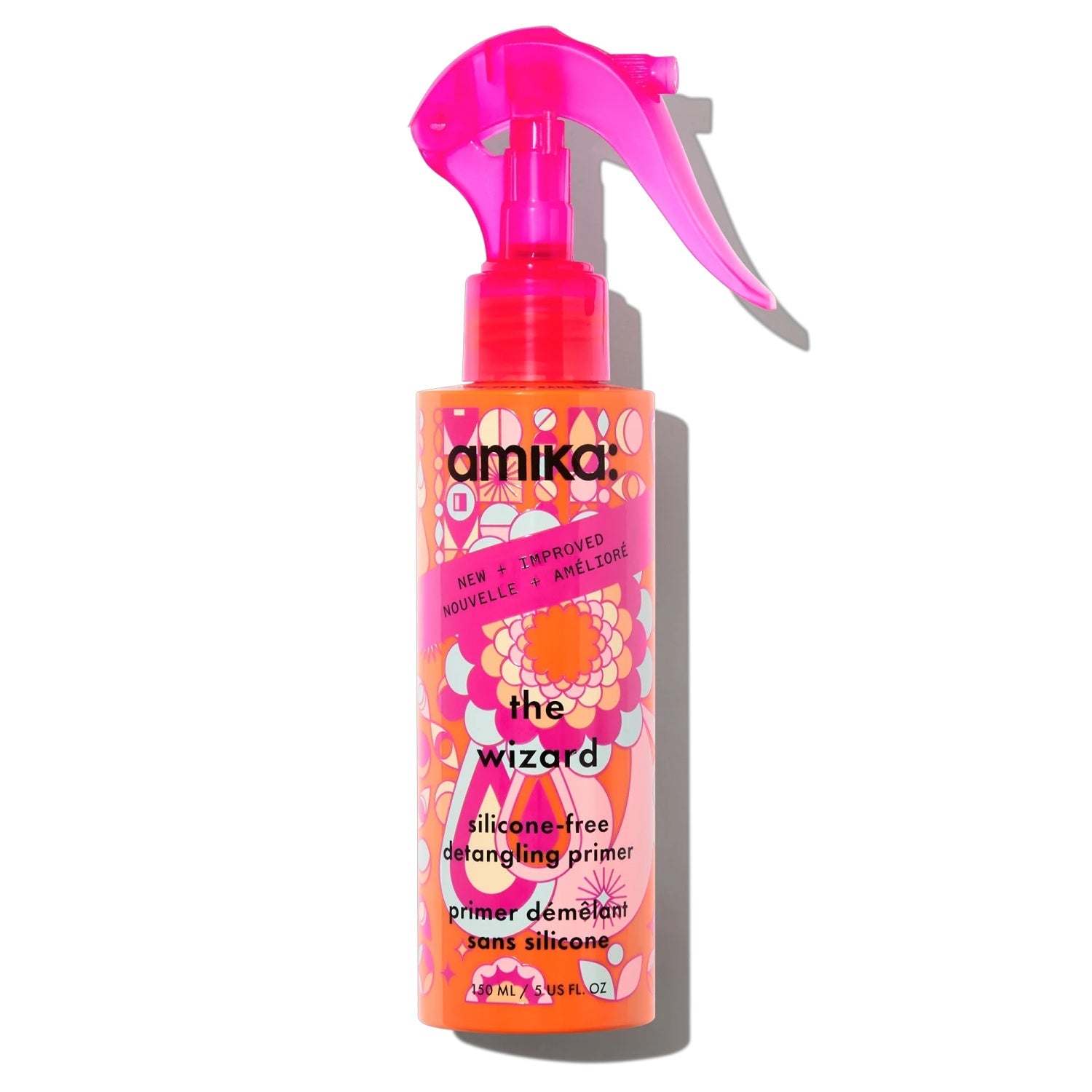 Amika The Wizard Silicone-Free Detangling Primer spray bottle in vibrant orange and pink packaging