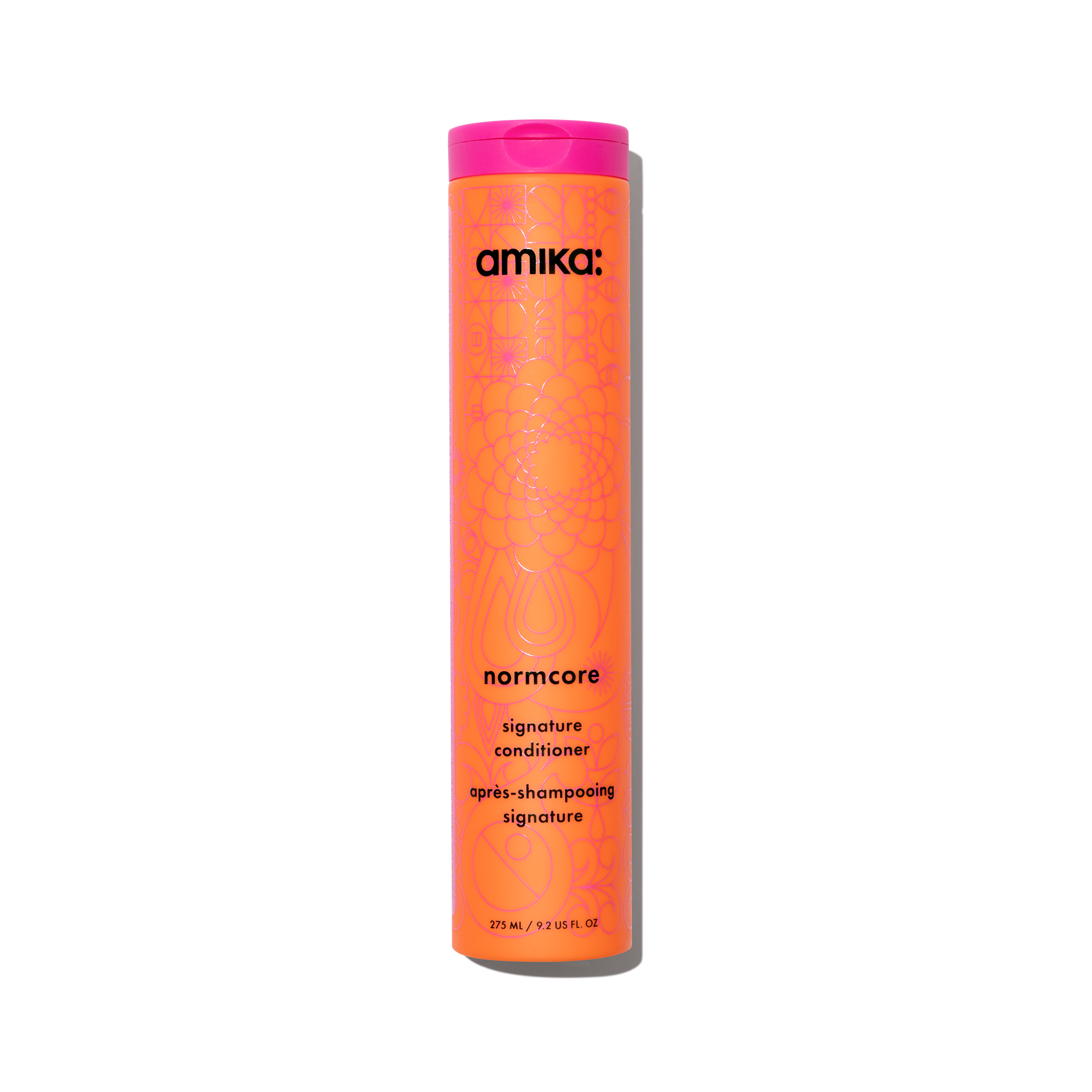 Amika Normcore Signature Conditioner bottle in signature orange and pink packaging