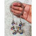 Silver bangle adorned with multicolor pearls and ornate latkan jhumki hangings