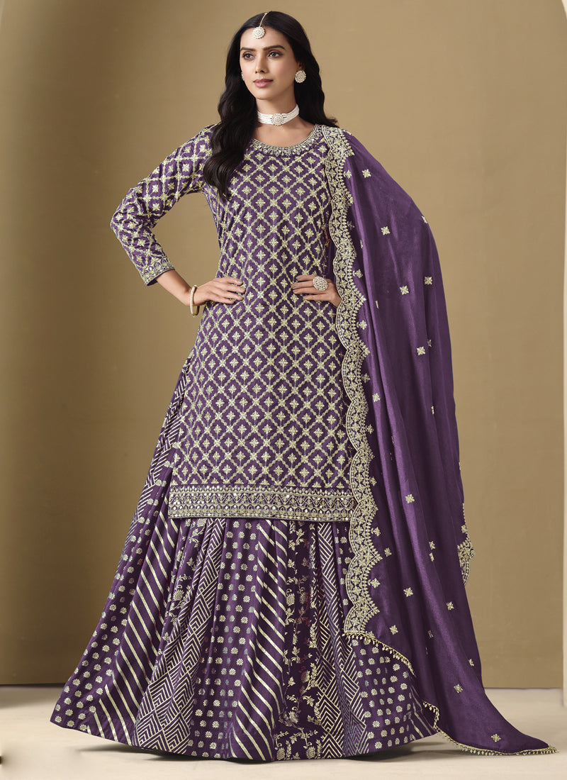 Purple art silk lehenga style suit with heavy embroidery and gota patti