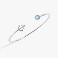 Anchor Flex Cuff bracelet featuring an air blue opal stone and a blue crystal detailed anchor charm.