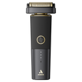 Close up of a sleek matte black and gold modern electric shaver on a clean surface