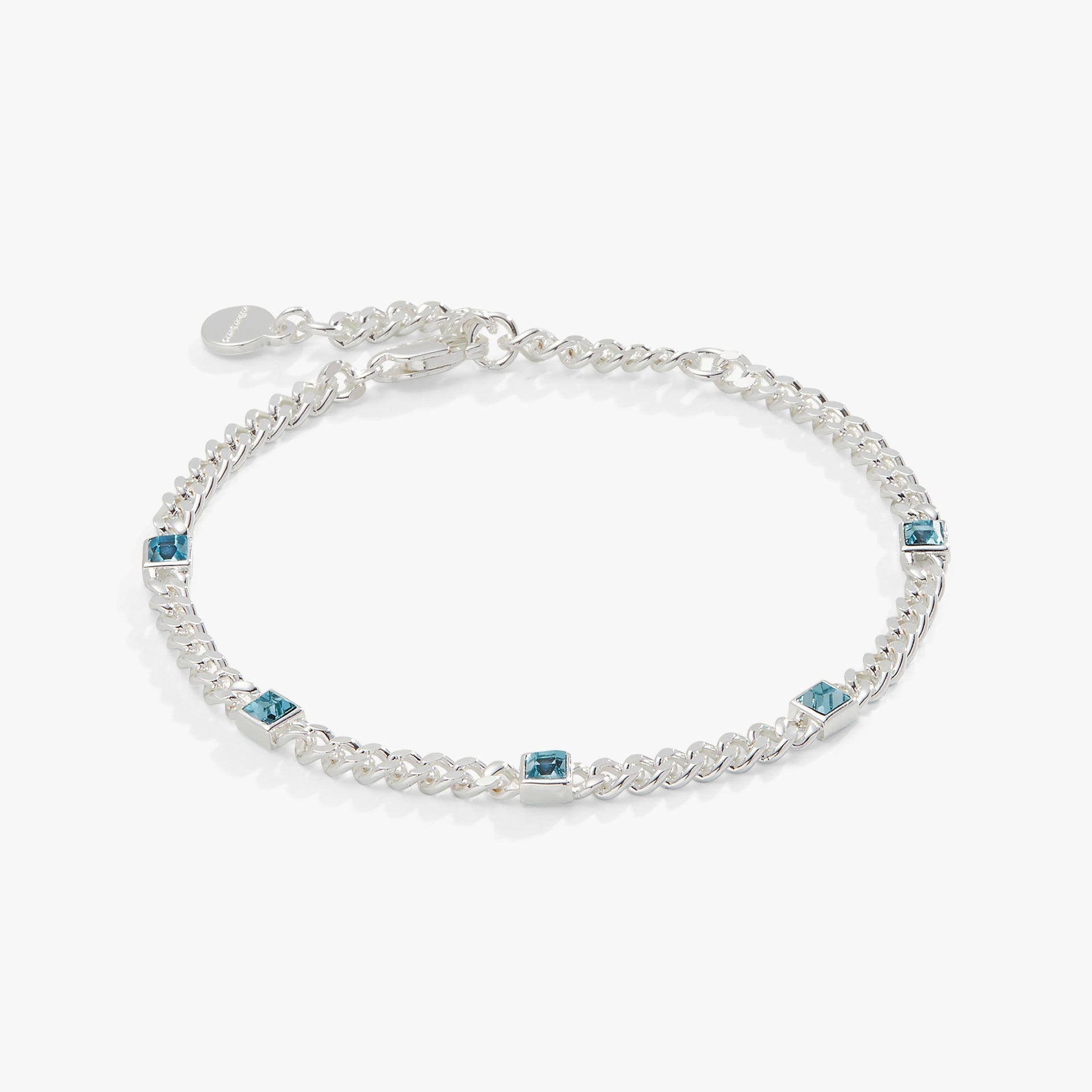 March birthstone bracelet featuring a faceted aquamarine gemstone on a gold curb chain.