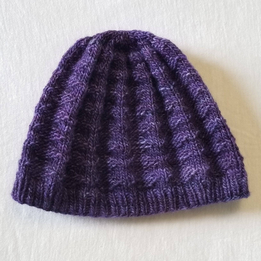 Close-up of a hand-knitted beanie made using the Arctic Beanie Easy Knitting Pattern.