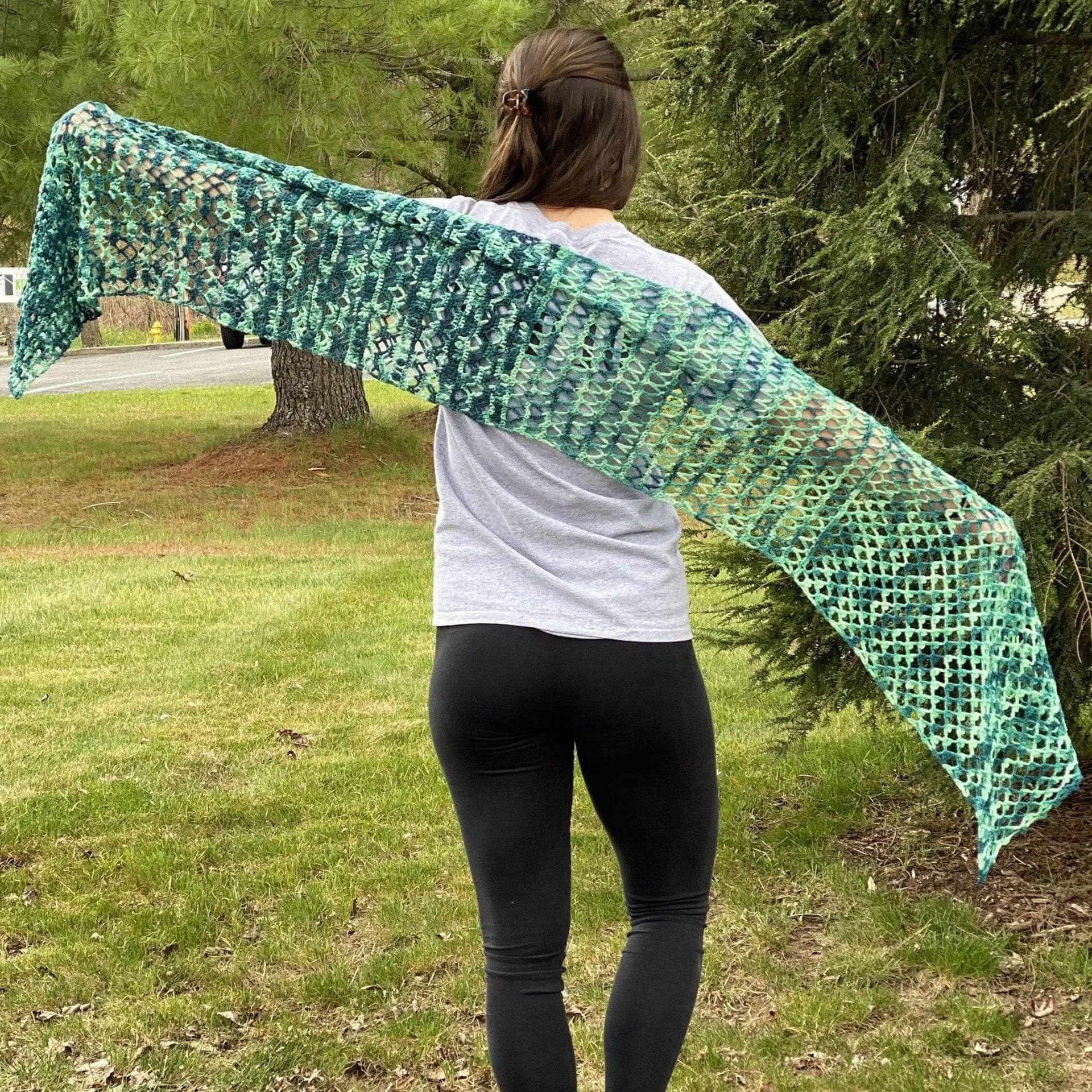A completed Ariel Shawl with a flared tail design, made from Malabrigo Sock Yarn.