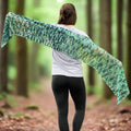 Beautifully crocheted Ariel shawl in shades of green and teal