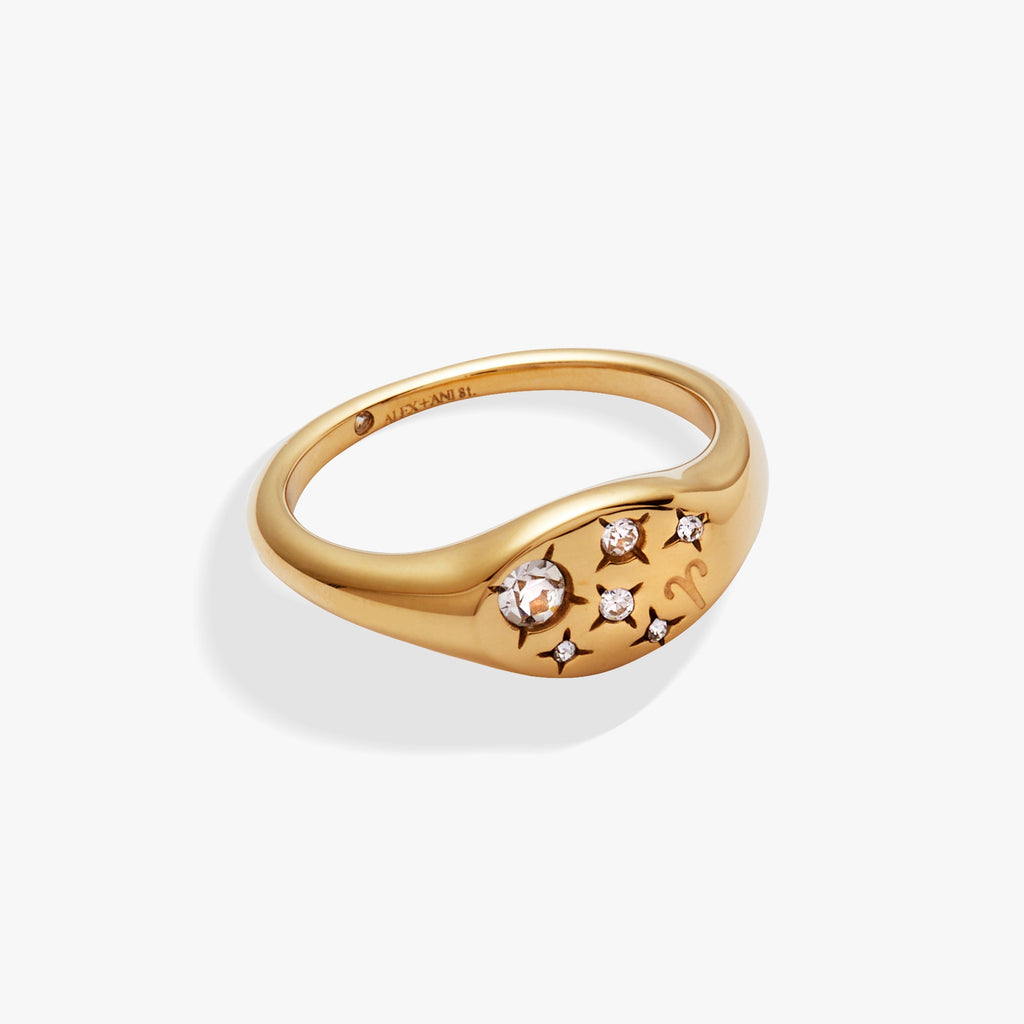 A close-up view of an Aries zodiac signet ring featuring an etched Aries symbol surrounded by shimmering crystals.