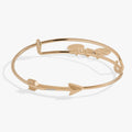 Silver-tone arrow motif bangle bracelet adorned with sparkling crystal accents.
