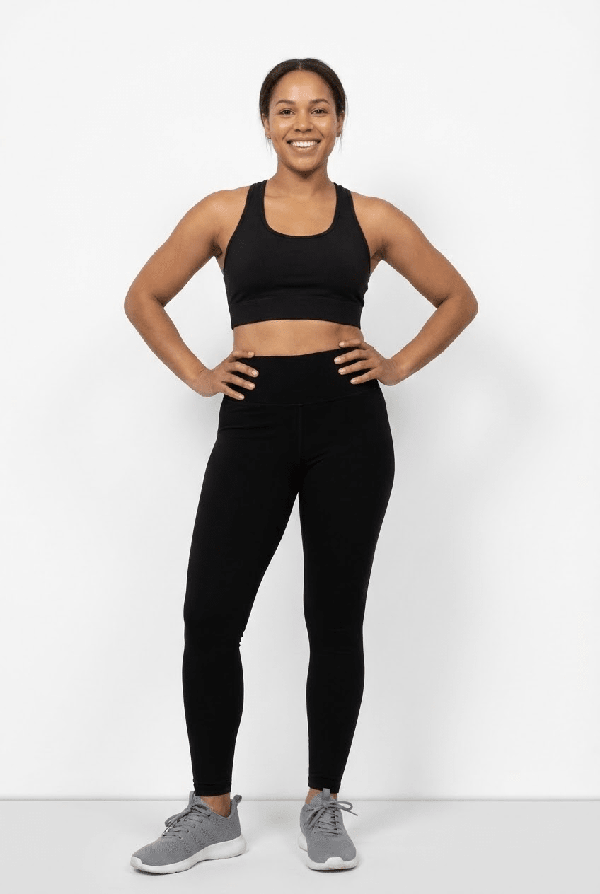 Model wearing black high-rise Aspen leggings with a matching sports bra