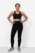 Model wearing black high-rise Aspen leggings with a matching sports bra