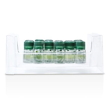 Clear and green bottle of Astera Soothing Freshness Fluid in a minimalist clinical setting