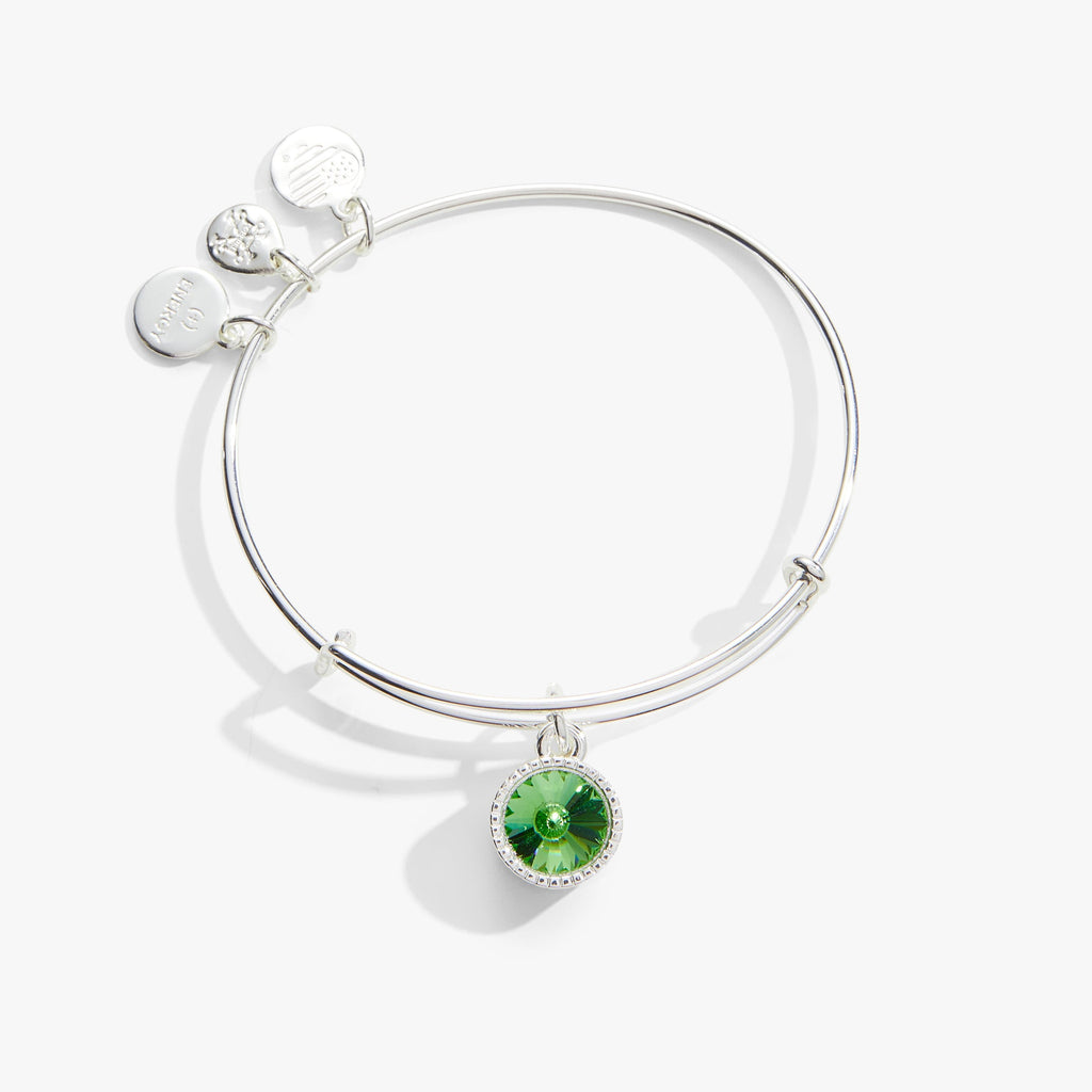 Minimalist silver-tone bangle featuring a green Peridot crystal charm for August