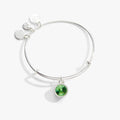 Minimalist silver-tone bangle featuring a green Peridot crystal charm for August