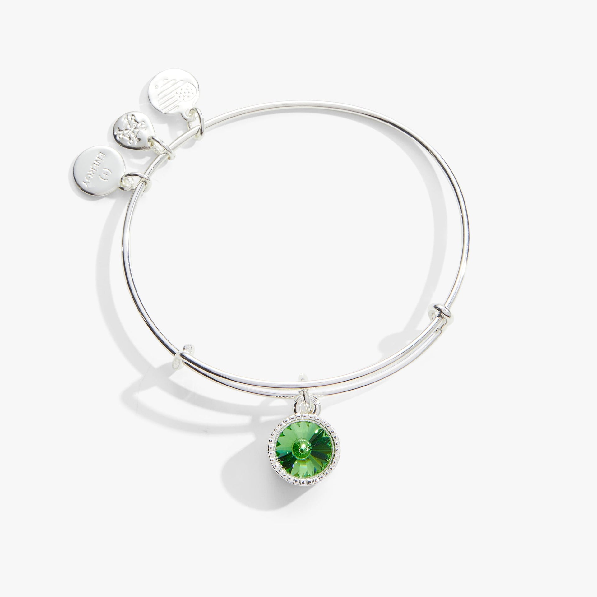 Minimalist silver-tone bangle featuring a green Peridot crystal charm for August