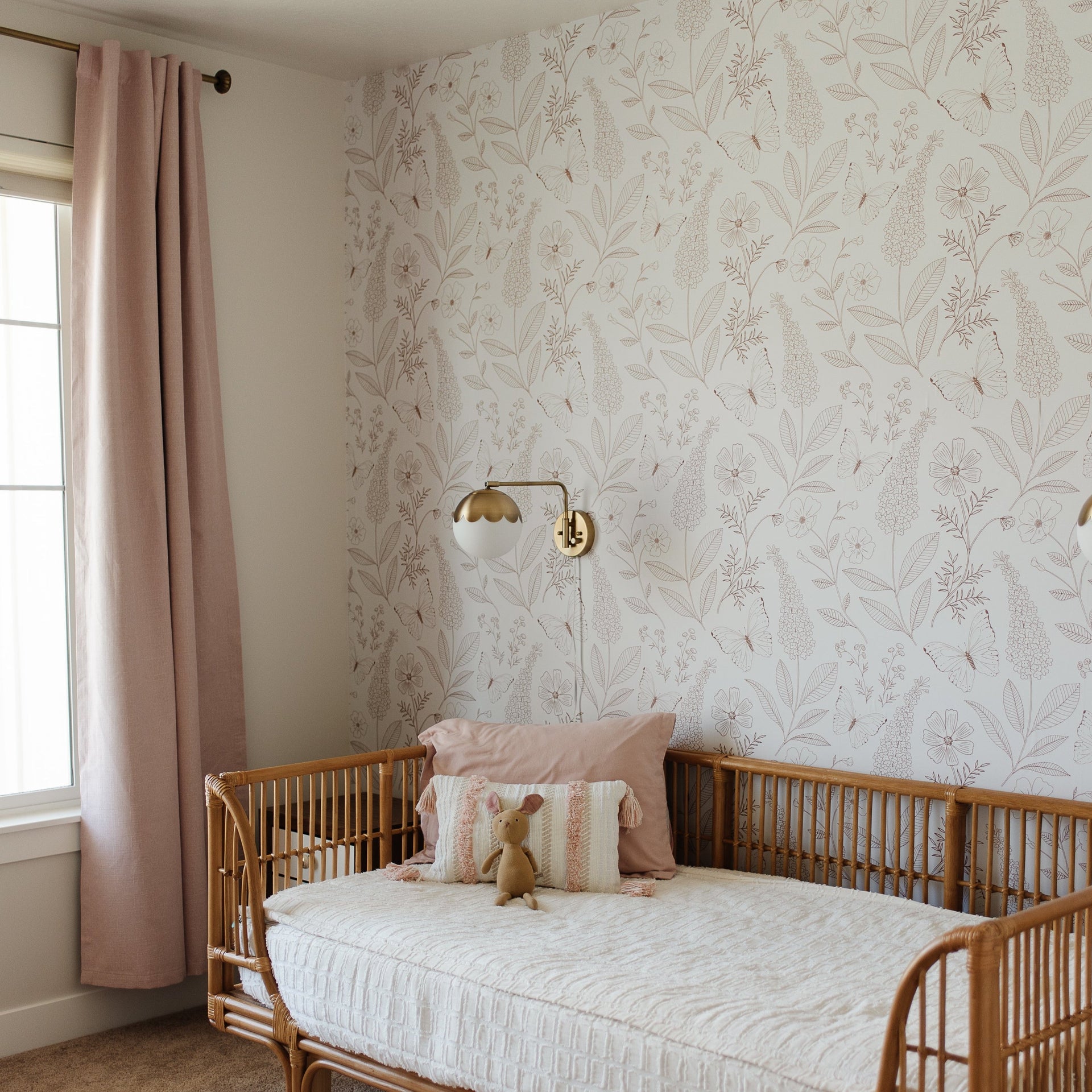Ashlyn floral wallpaper in soft blue and pink tones.