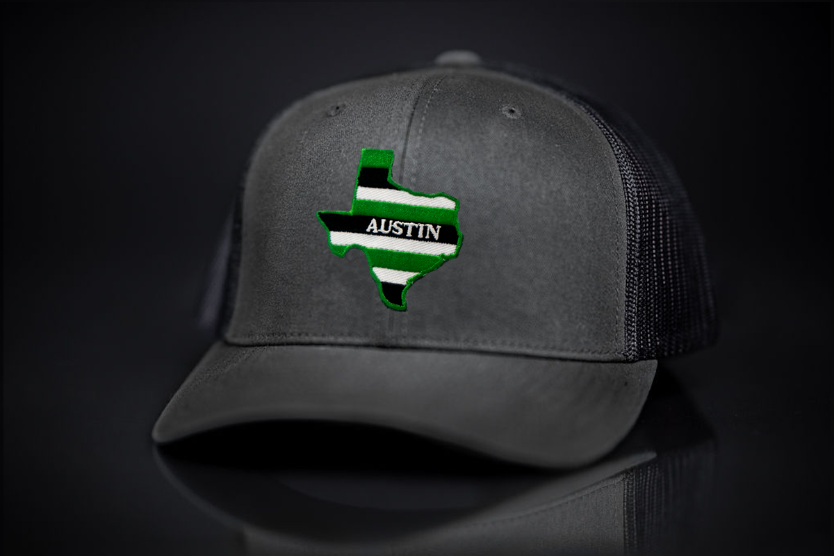 Austin State of Texas curved bill mesh snapback hat in Verde featuring a high-contrast graphic.