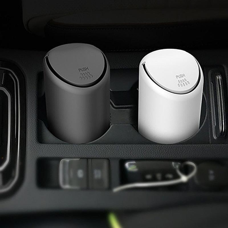 Mini silicone car trash can designed to fit into a vehicle cup holder for easy waste management