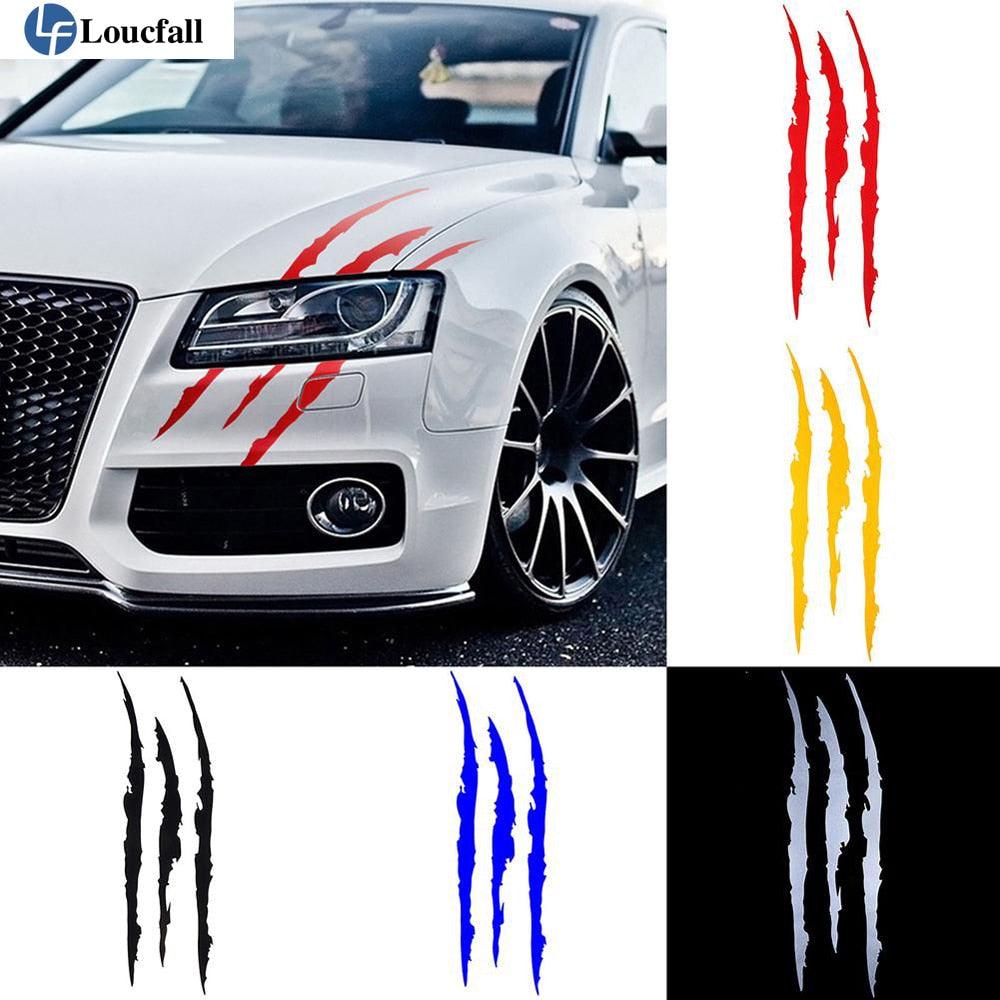 Monster claw reflective vinyl car sticker applied to a vehicle headlight for a sporty aesthetic