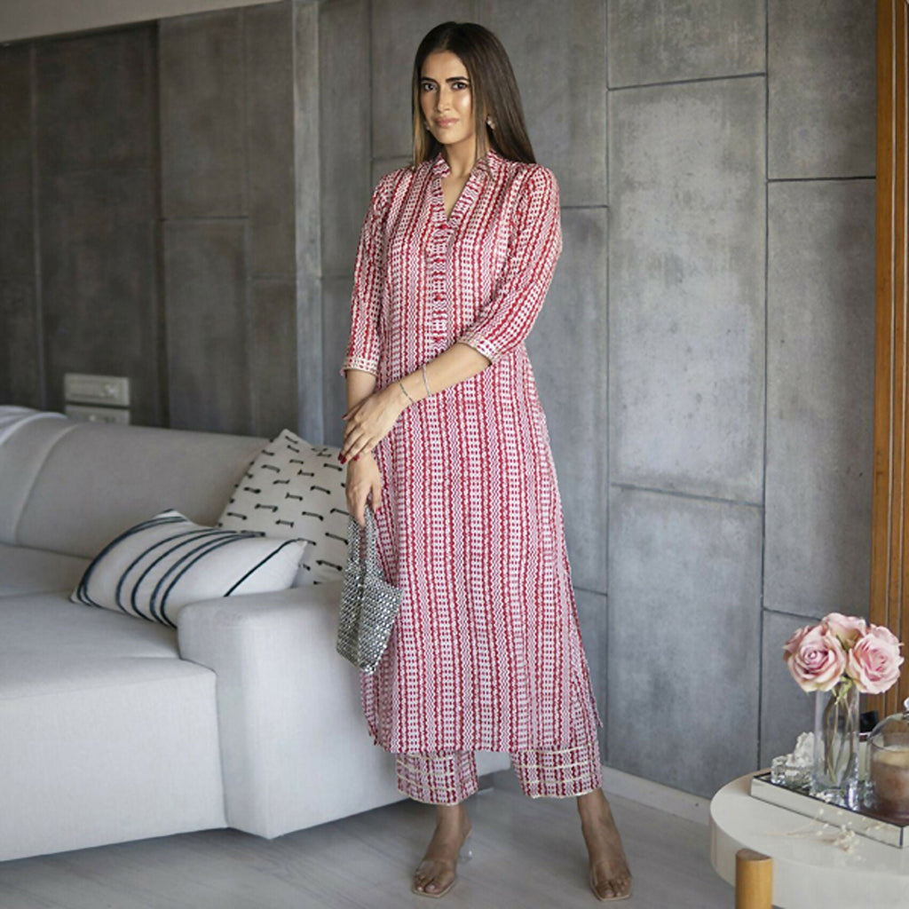 Women wearing a Pink Pure Muslin straight kurta and pant set with heavy digital floral print