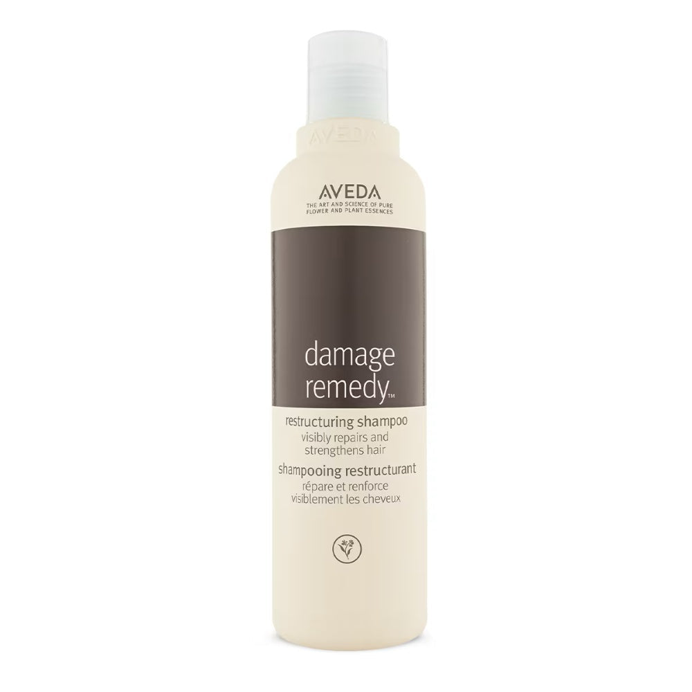 Aveda Damage Remedy Restructuring Shampoo bottle in beige and brown minimalist packaging