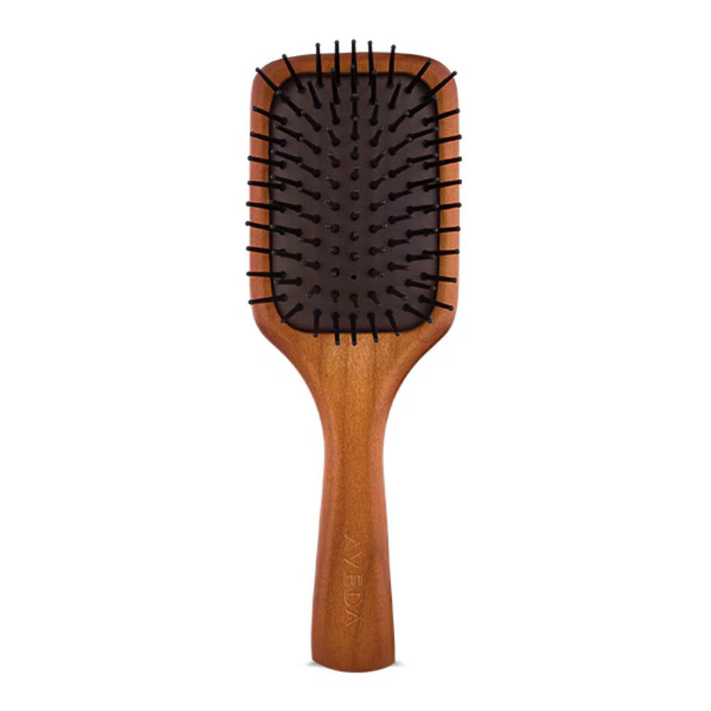 Aveda wooden mini paddle brush with natural wood handle and black bristles, minimalist hair styling tool.