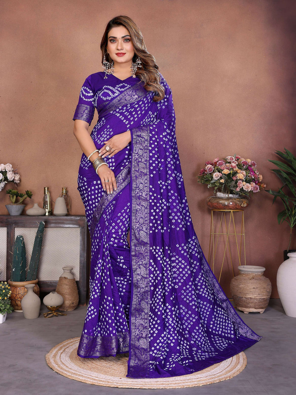 Deep purple Dola silk saree featuring authentic handmade Bandhej tie-dye patterns.