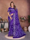 Deep purple Dola silk saree featuring authentic handmade Bandhej tie-dye patterns.