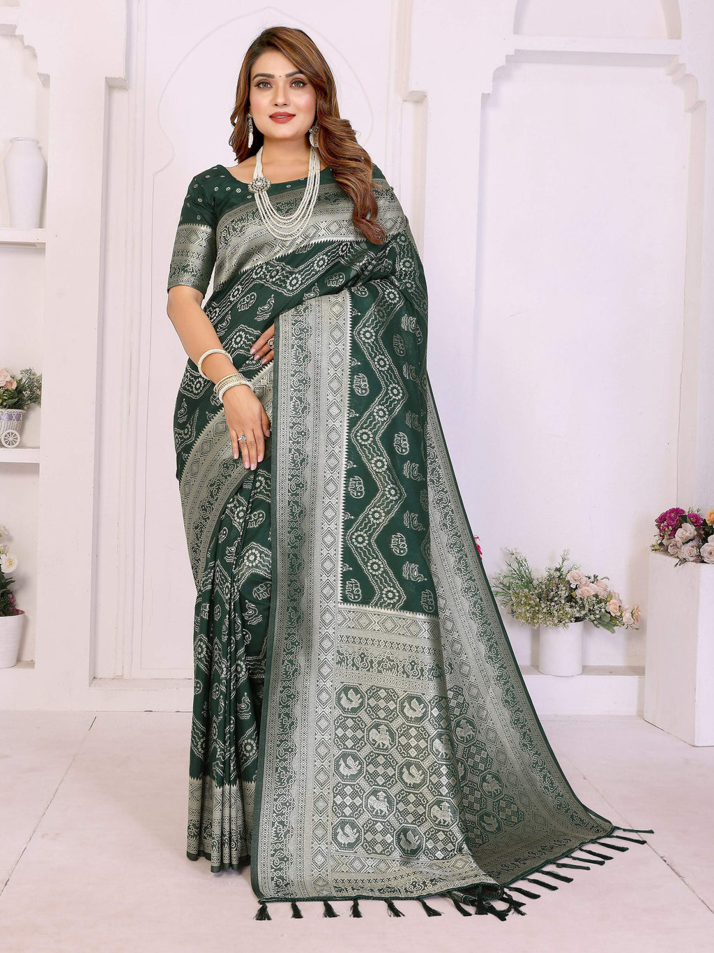 A vibrant green georgette silk saree with traditional Leheriya patterns and zari weaving.