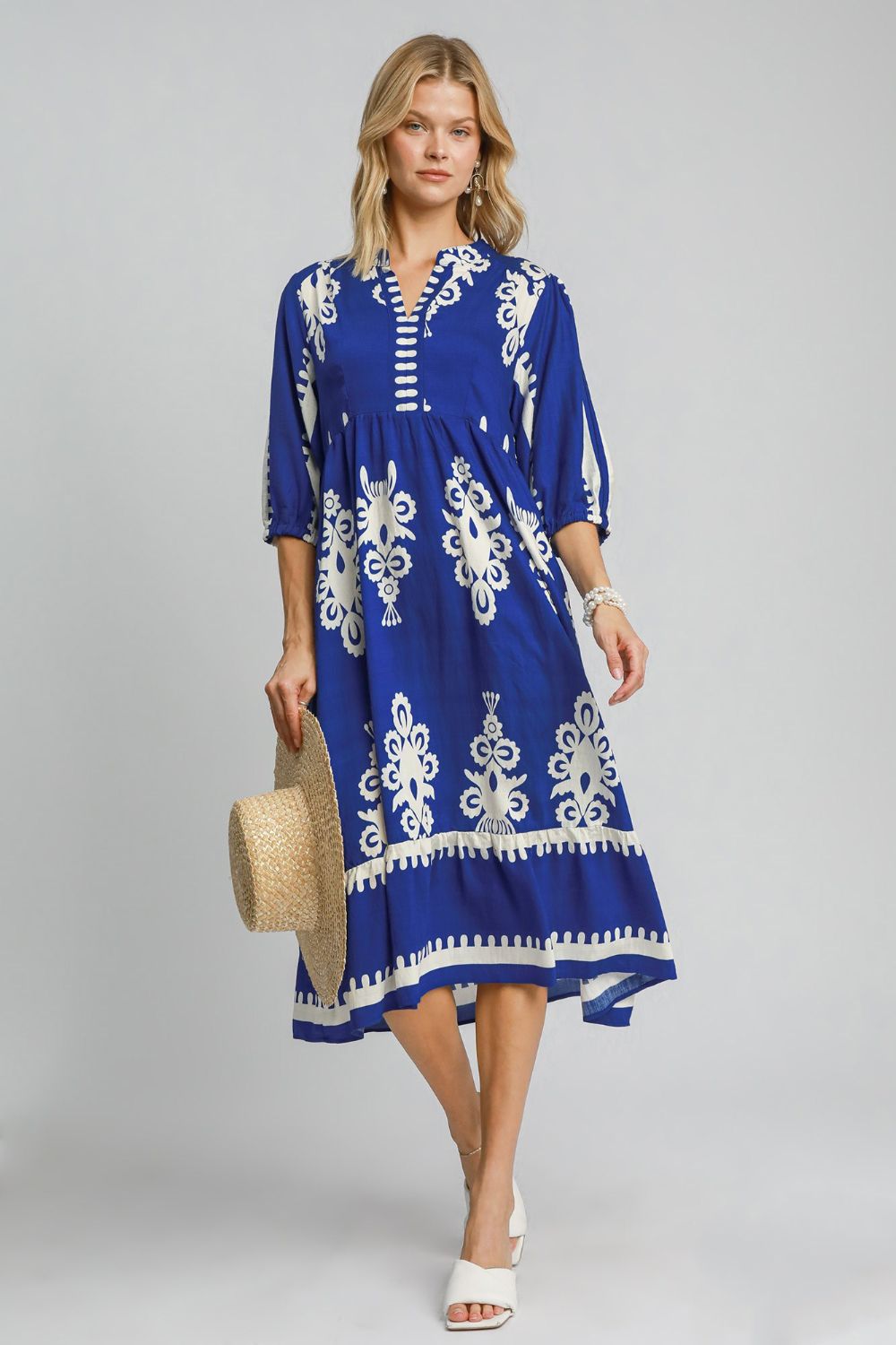 Royal blue and white printed midi dress with a notched neckline