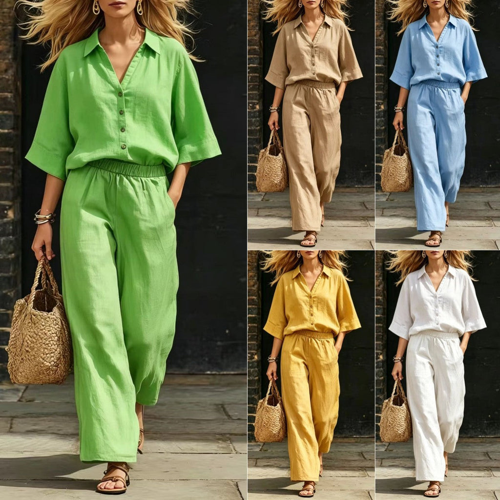 Model walking in a relaxed-fit matching two-piece set consisting of a green button-down shirt and matching wide-leg trousers with pockets.